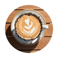 Cup of freshly brewed latte featuring heart-shaped latte art made with rich espresso and steamed milk.