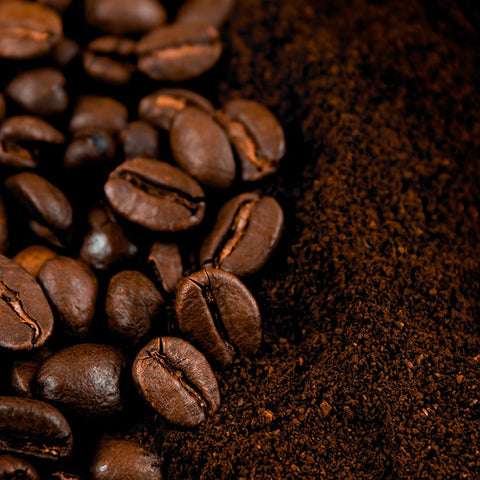 Close-up of roasted whole coffee beans and freshly ground coffee, highlighting rich aroma, freshness, and specialty coffee quality for home baristas.