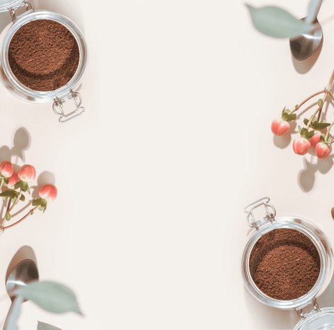 Coffee-themed website banner featuring coffee beans, freshly ground coffee in glass jars, botanical accents, and a clean background for specialty coffee branding.