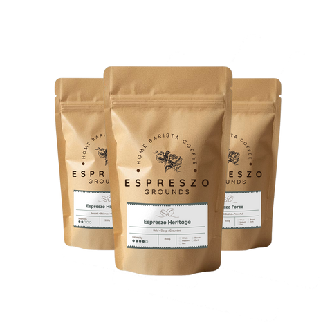 Three bags of Espreszo Coffee Grounds on a white background
