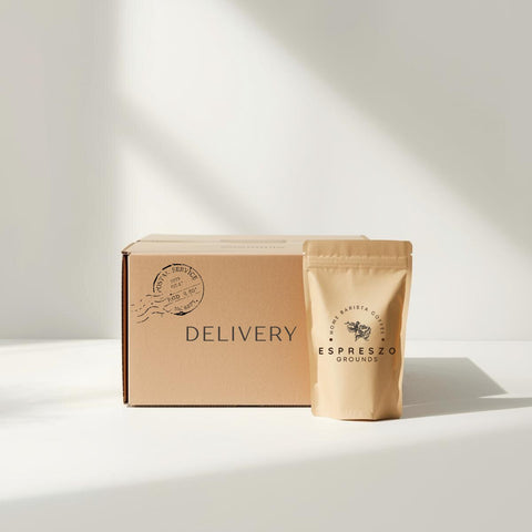 Espreszo grounds package and cardboard box with 'Delivery' text on a white background